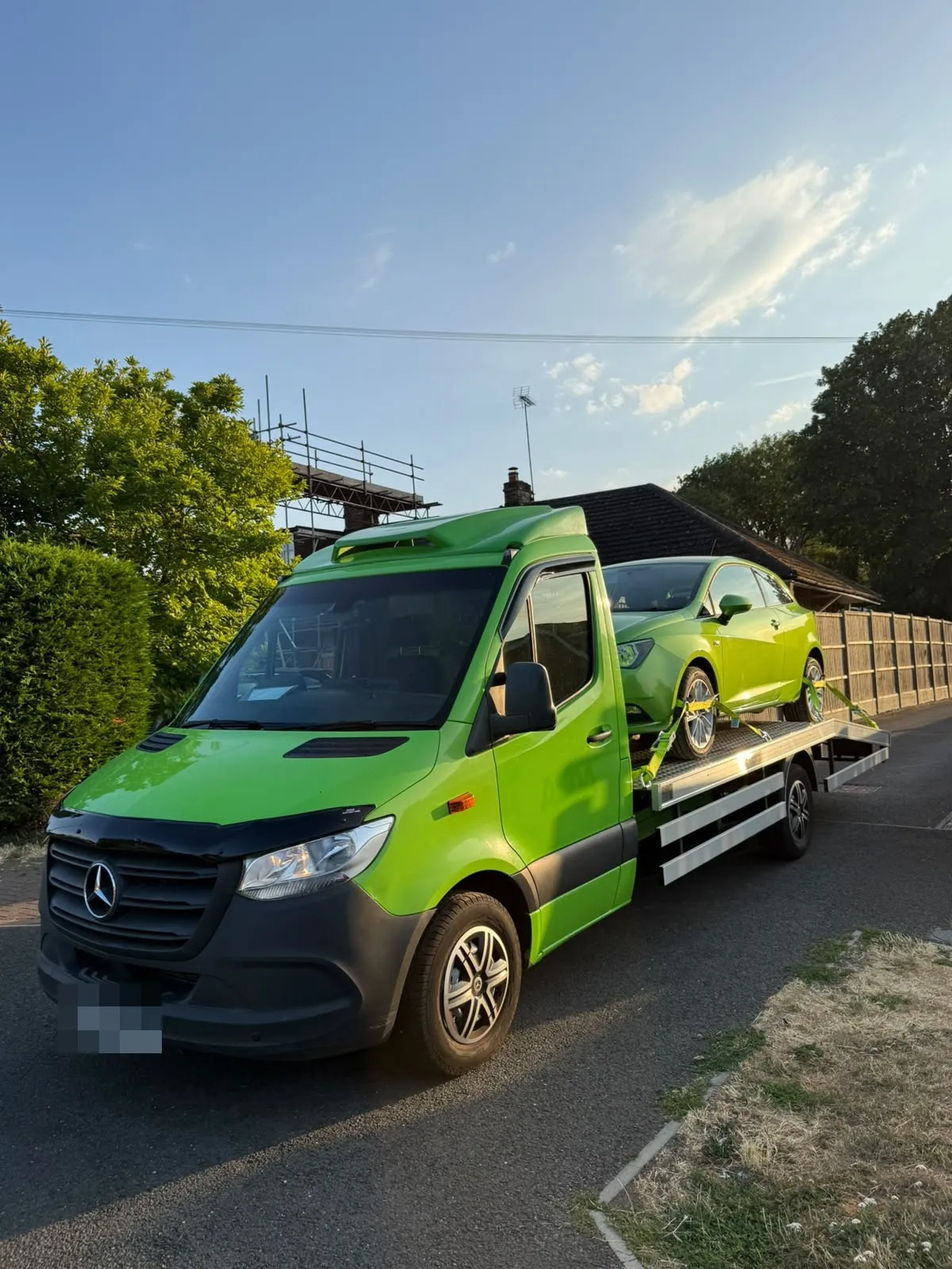 Front of the lime green Sprinter flatbed with a green Seat on the deck